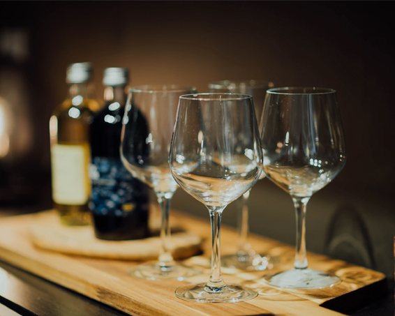 wine glasses on wooden board