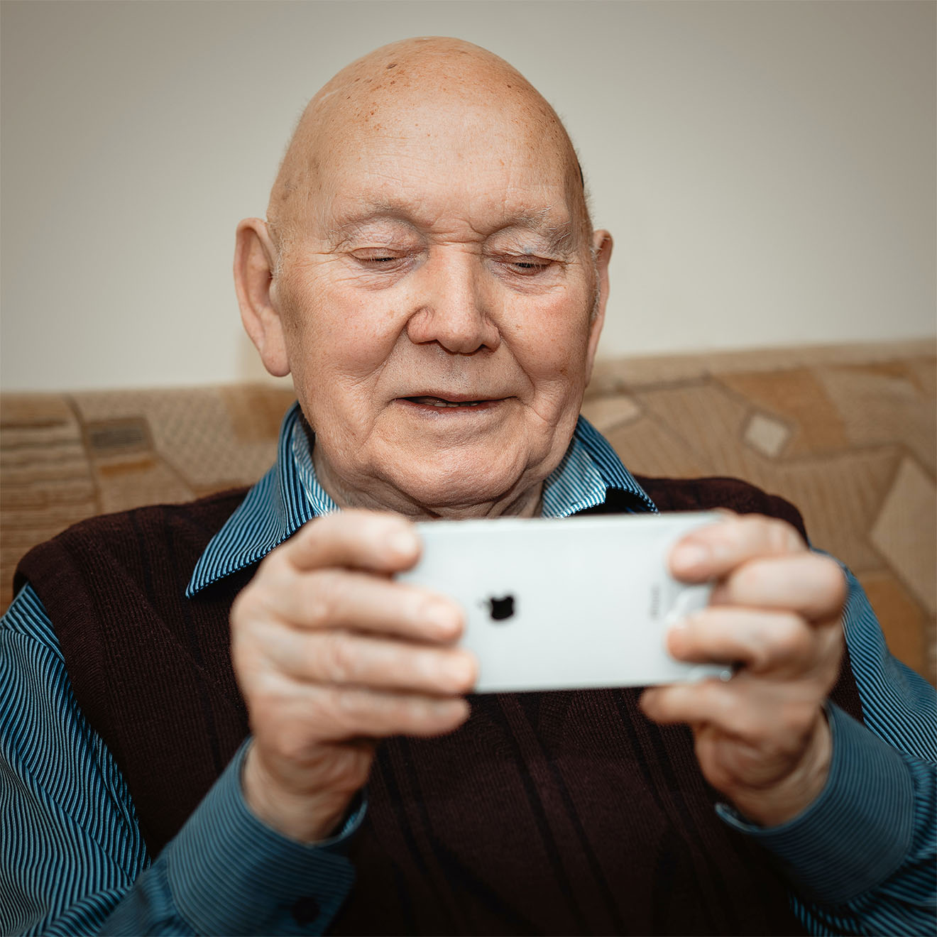 resident playing a game on their phone