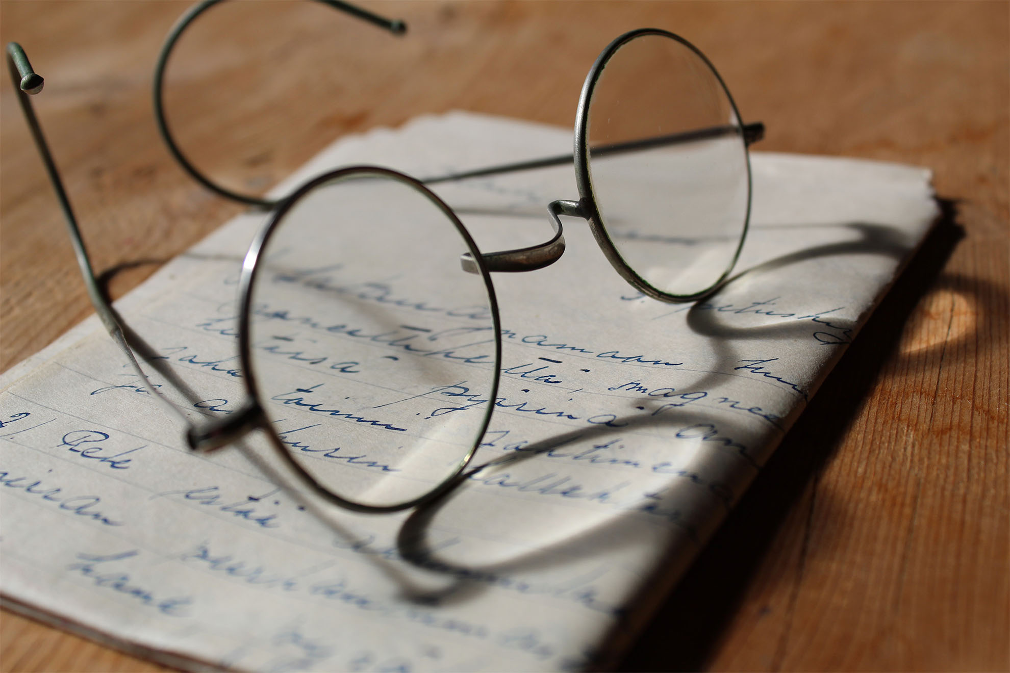 glasses on top of a letter