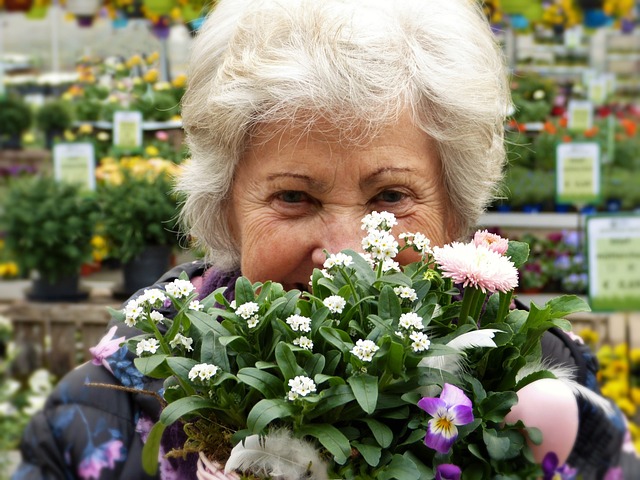 resident at a garden centre buying flowers