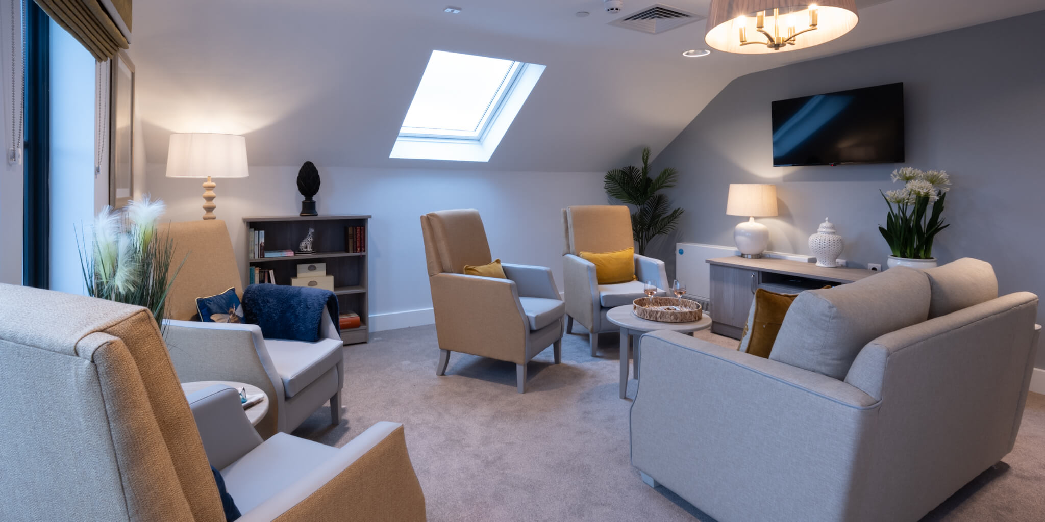 Living Room With Armchairs and TV at Rowan Park Care Home