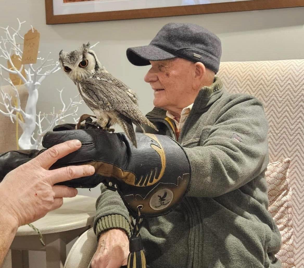 resident holding an owl