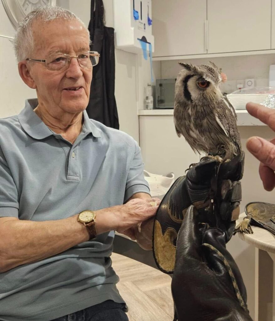 resident holding an owl