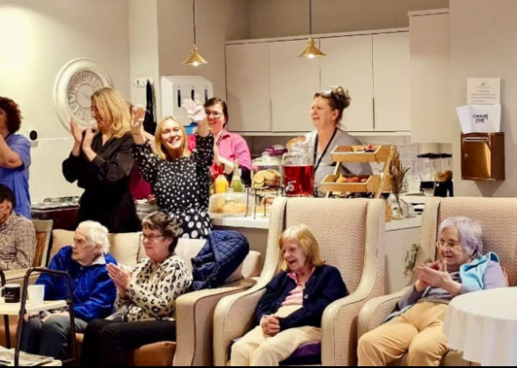 residents singing and dancing together