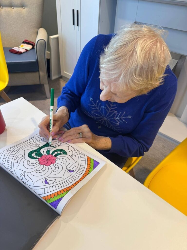 resident doing colouring