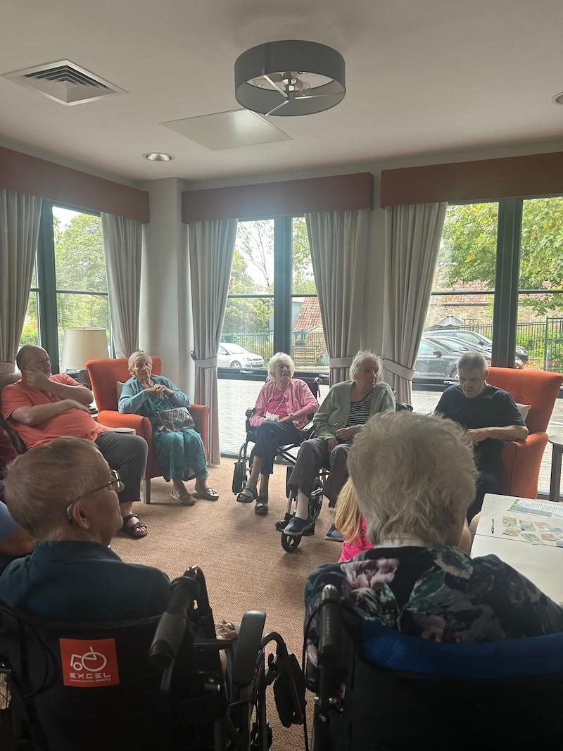 residents sat together in the lounge
