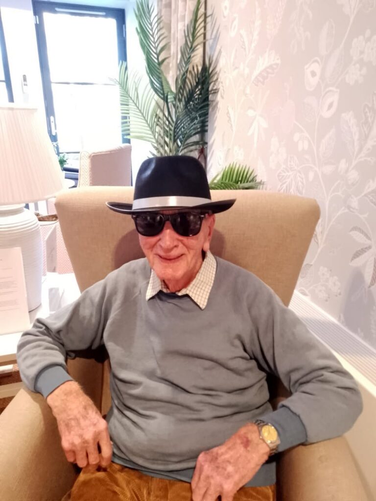resident in chair with sunglasses