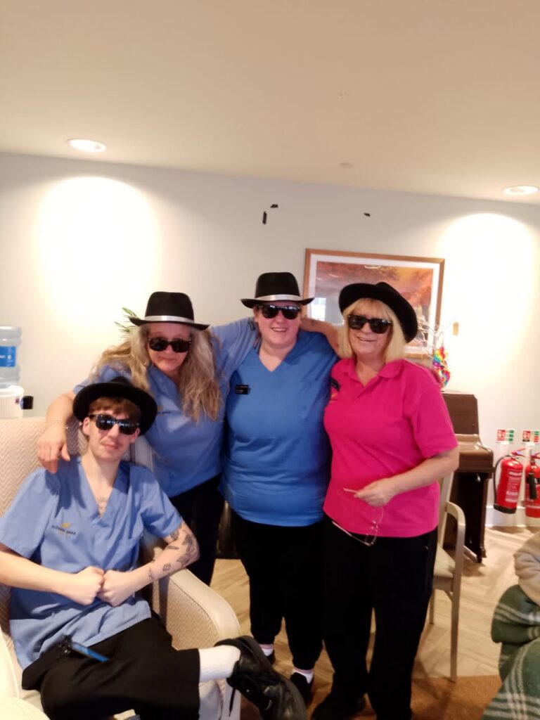 carers with sunglasses and hats