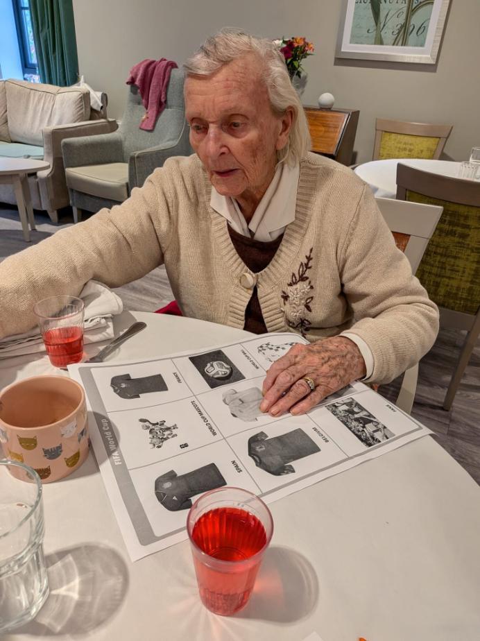 an older lady playing world cup bingo