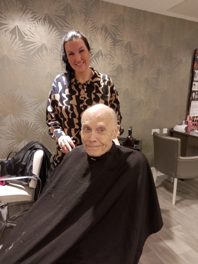 elderly man in our salon getting his hair cut